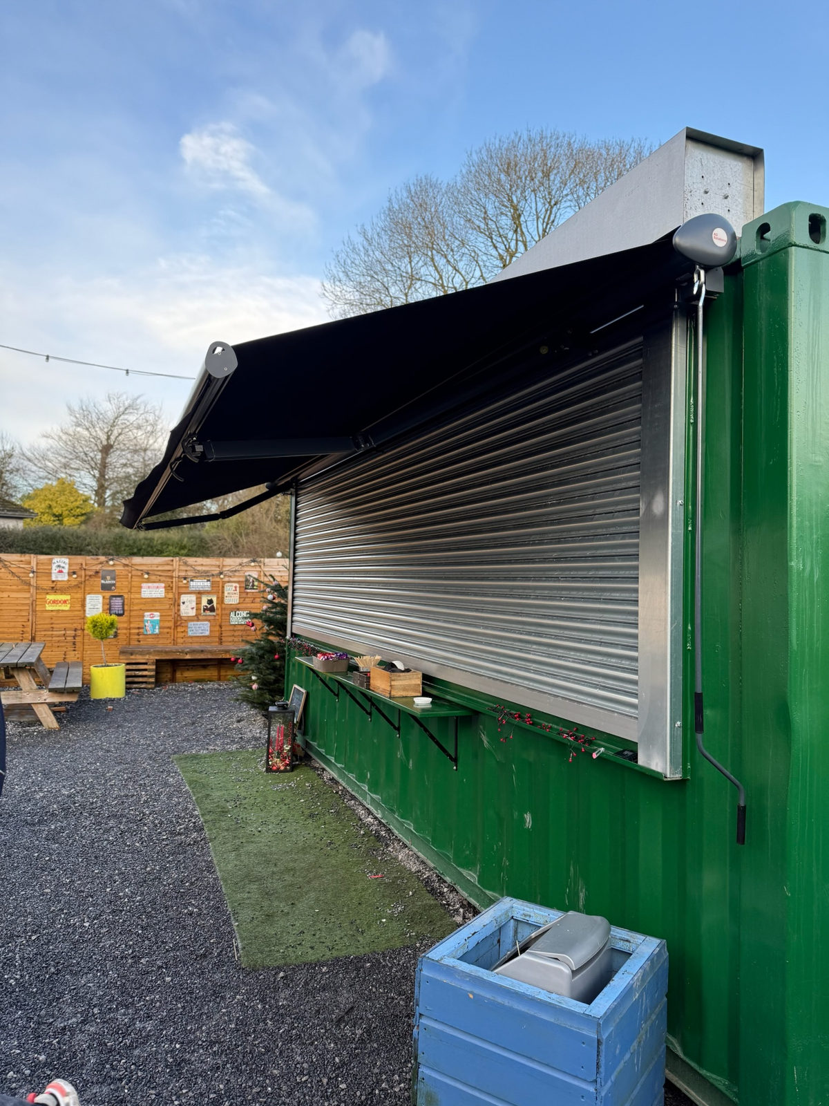 Wide Manual Awning with a Shallow Projection in Trim