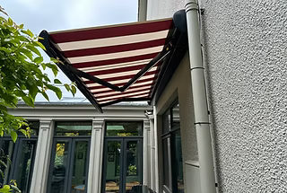 Red-and-Cream Striped Full Cassette Awning in Dalkey