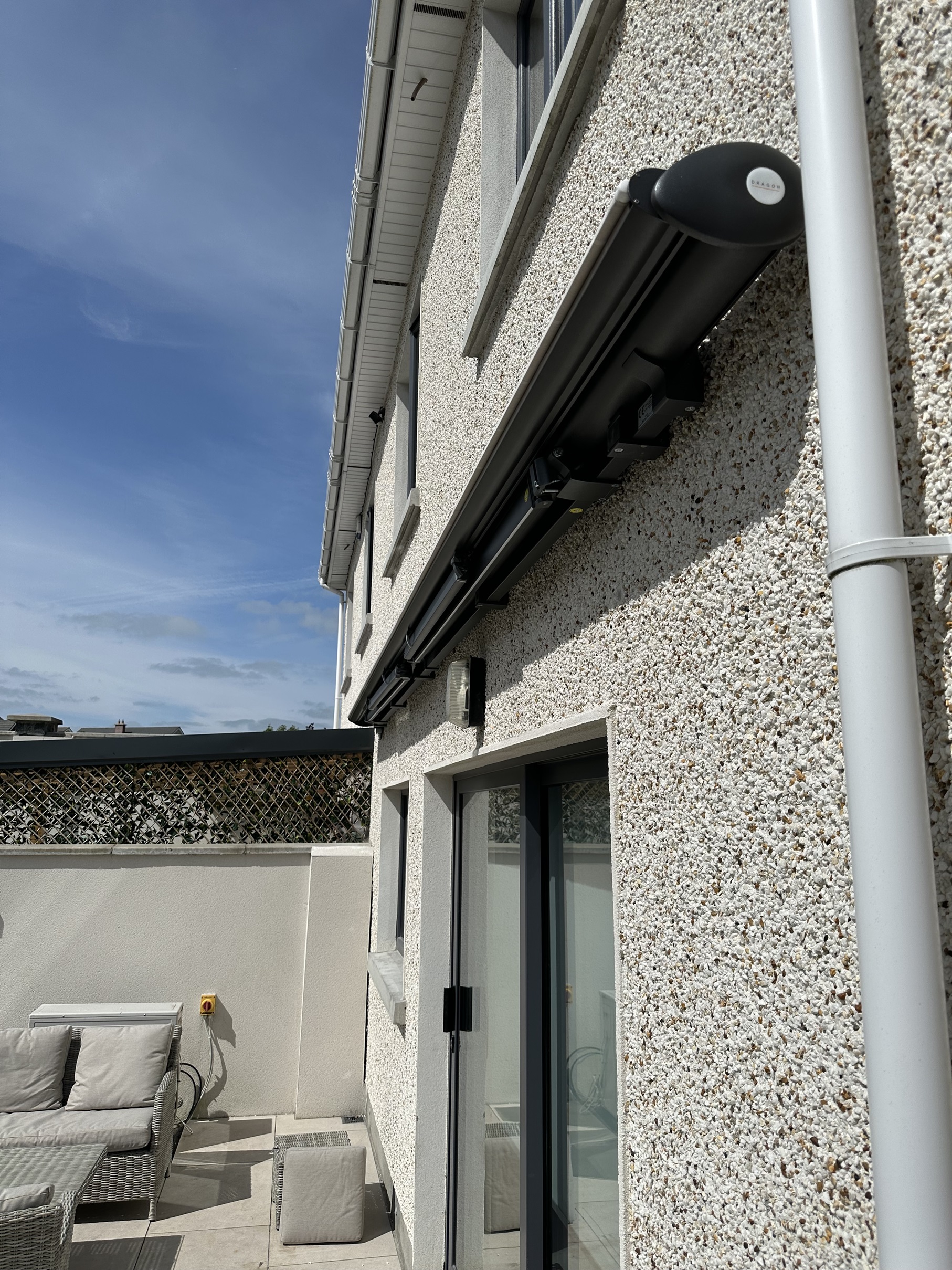 Awning PRO LED with rollable front valance installed in Dunshauglin