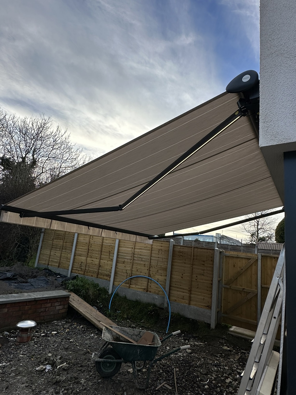 Awning in anthracite colour and lights