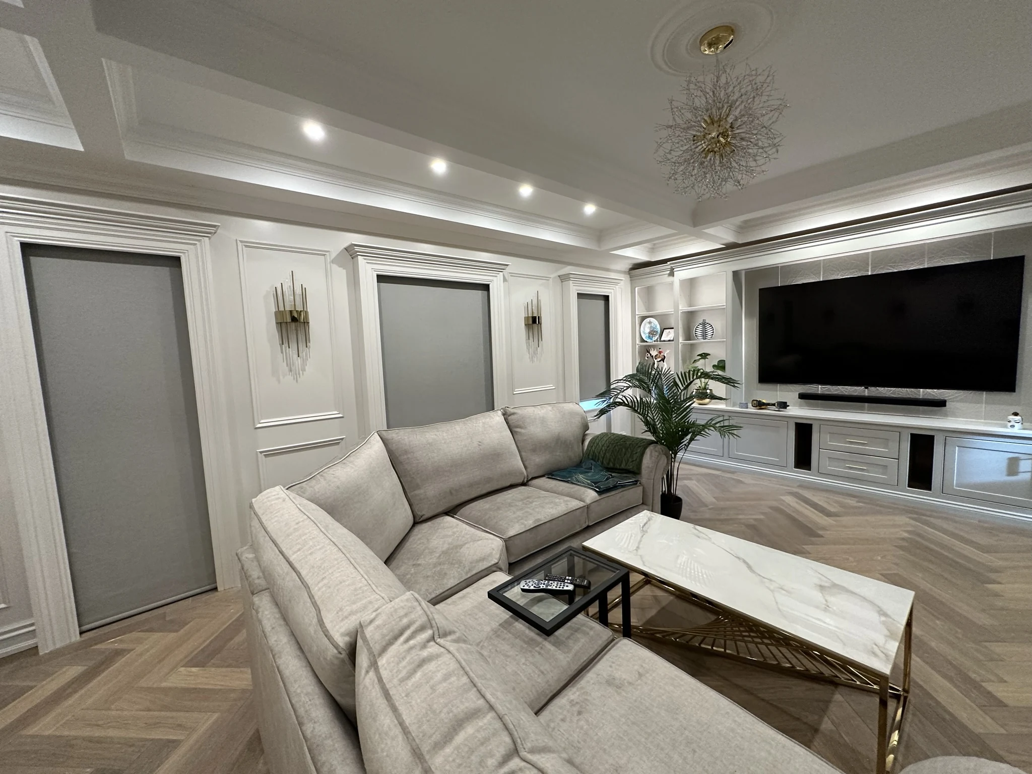 Motorised blinds coordinated across a bright living room
