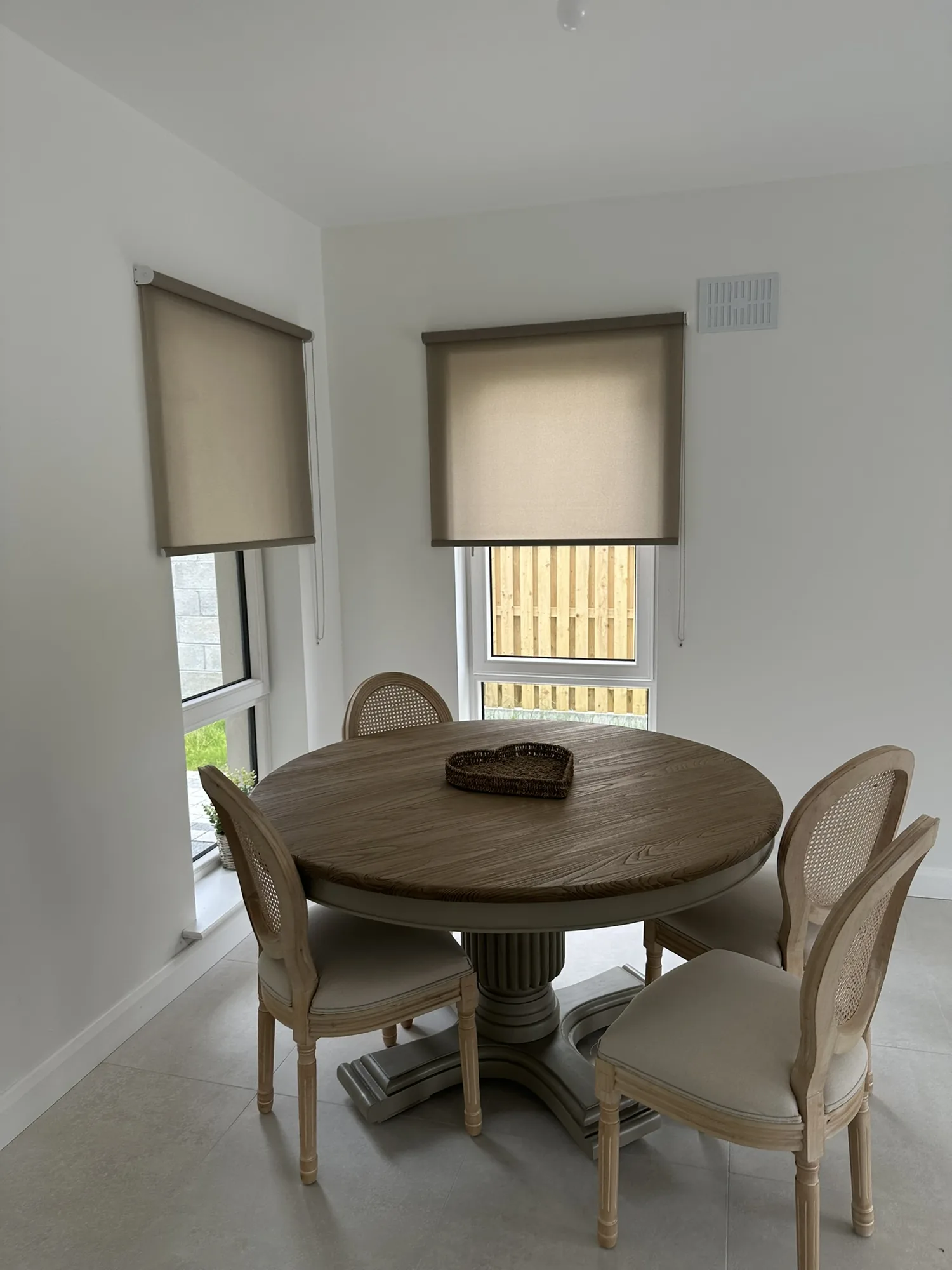 Neutral roller blinds fitted to dining room windows in Kildare