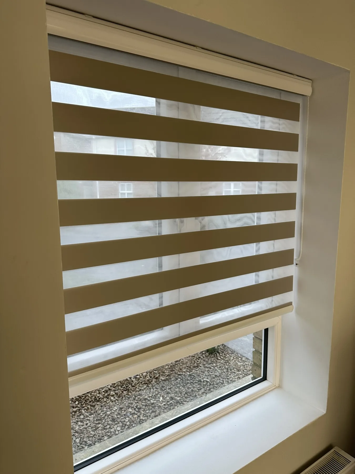 Neutral day and night blind adjusted for increased privacy