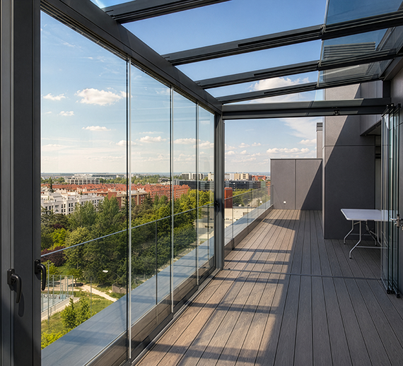 Glass roof pergola and sliding glass enclosure overlooking a city