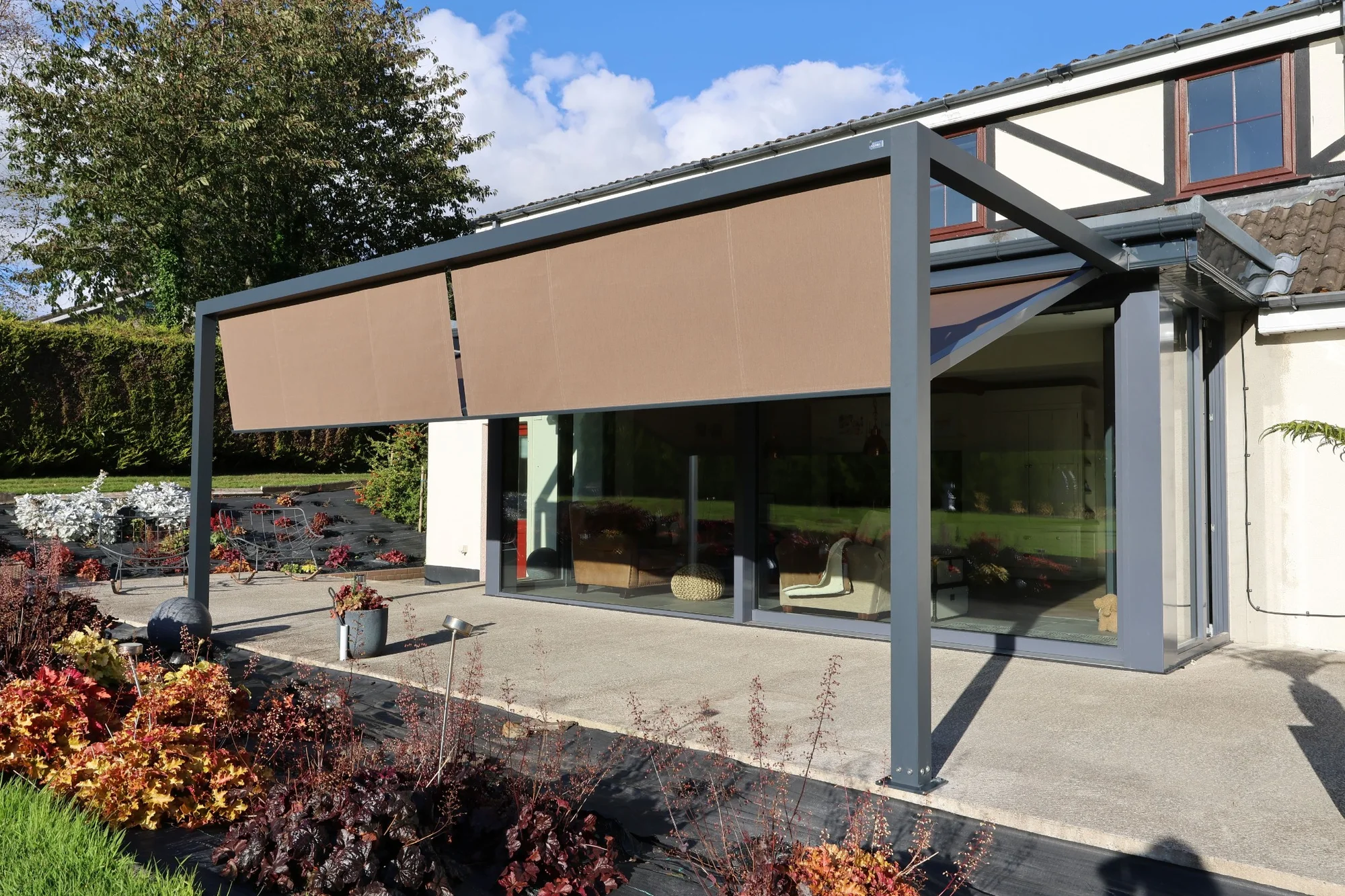 Pergola Square with front fabric shading across a residential terrace