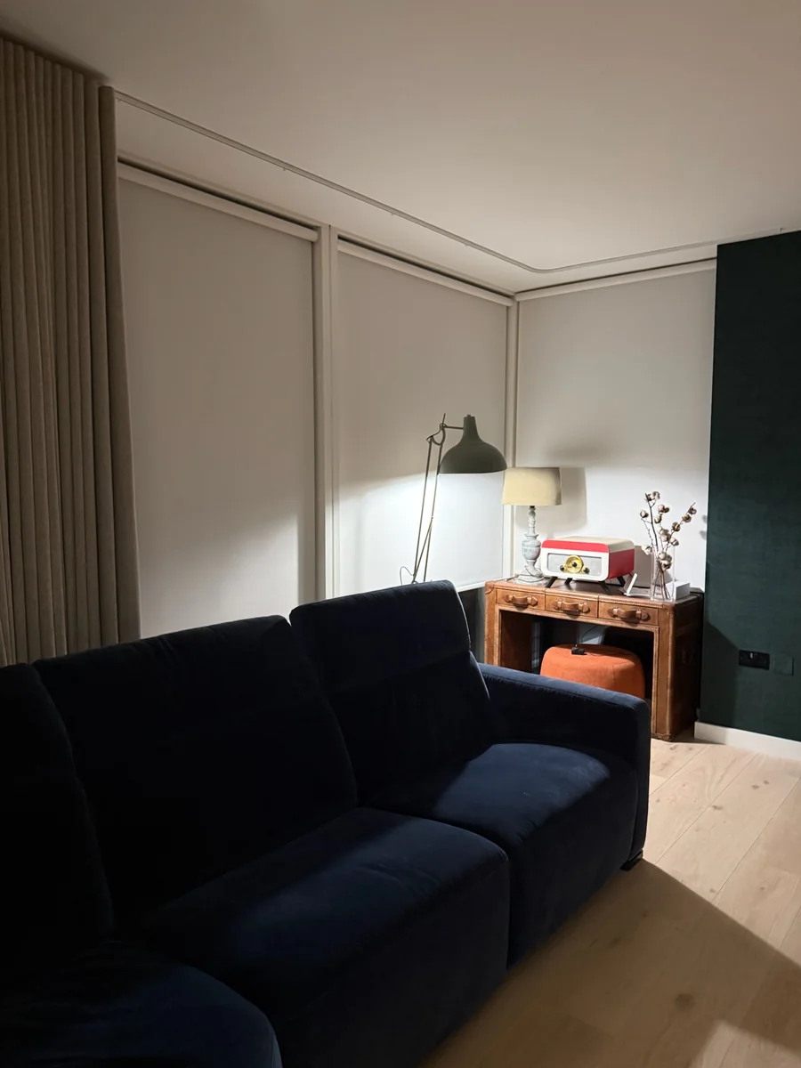 Made-to-measure roller blinds providing privacy in a living room