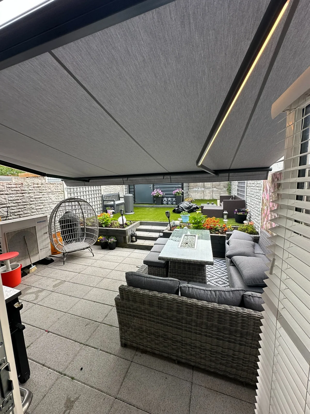 Semi cassette awning with integrated arm lighting over a residential patio in Meath