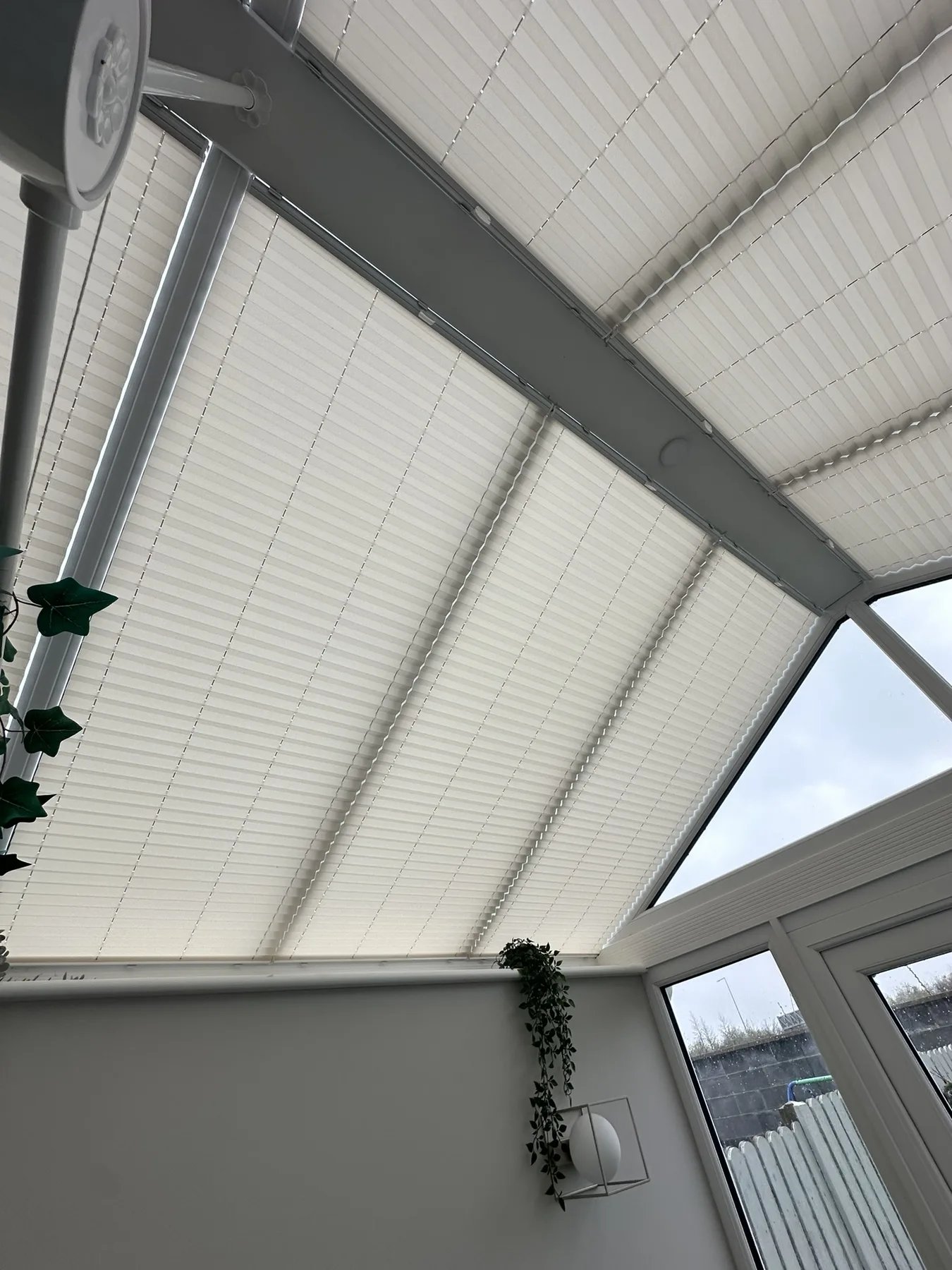 Close view of pleated roof blinds fitted to a conservatory