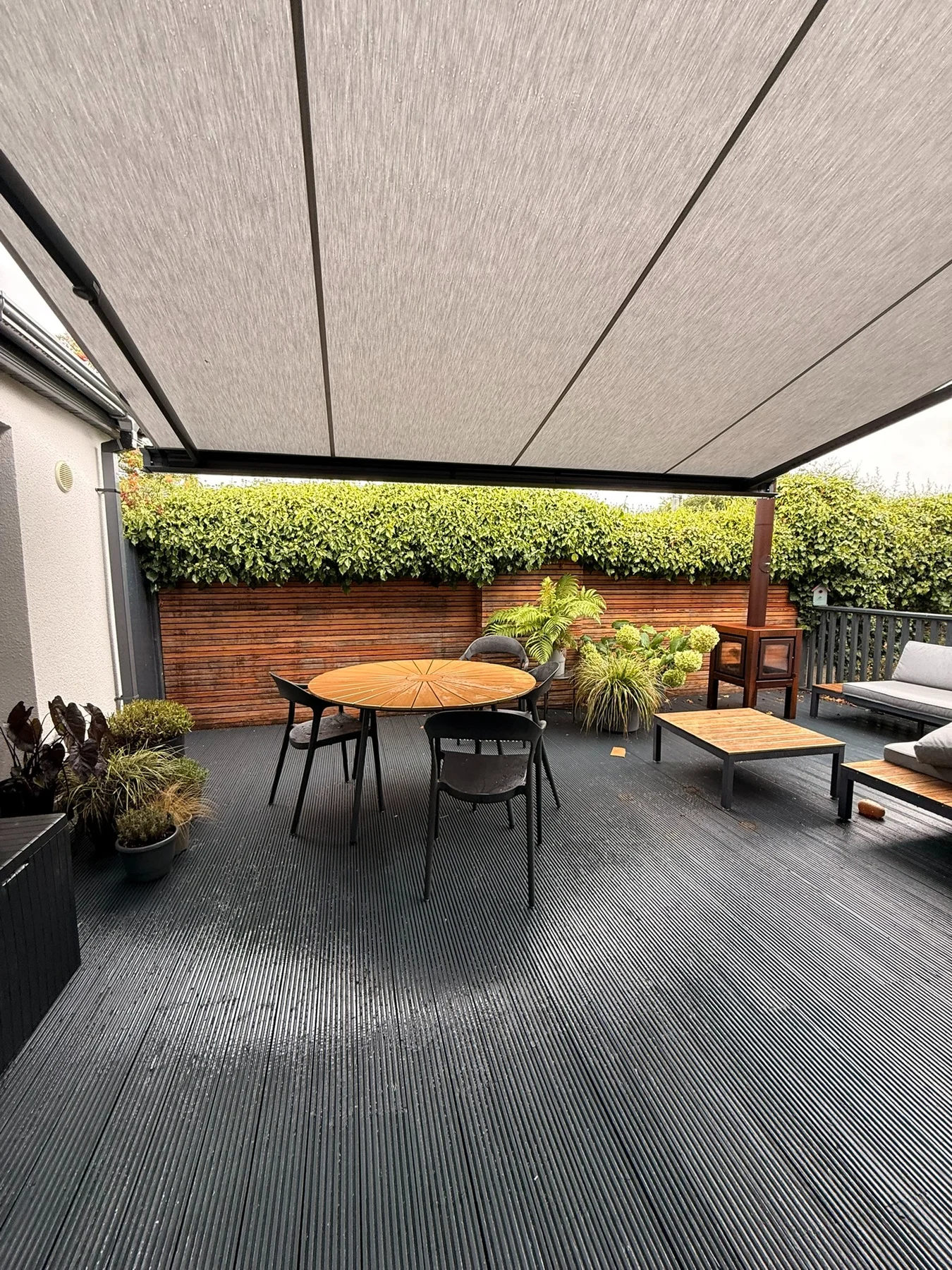View from beneath a SLIMLINE retractable awning over a residential patio in Dublin
