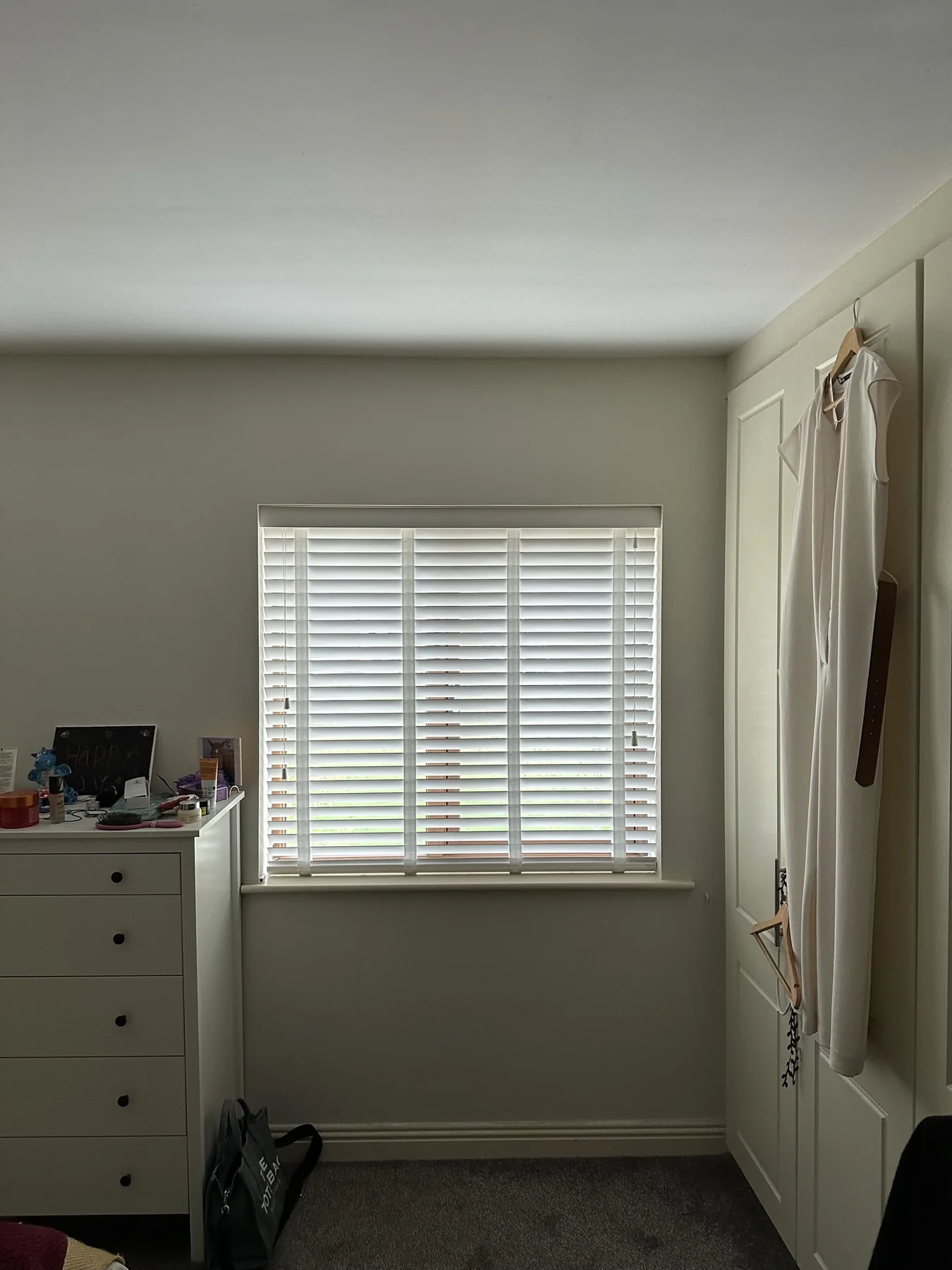 White Venetian blind fitted in a bedroom