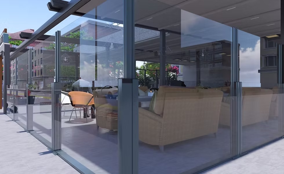 Made-to-measure glass windbreak installed around a garden terrace in Dublin